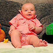Thomas joined the competition — help win amazing prizes! baby, infant, plush_toy, cow_toy, chicken_toy, toy_tractor, couch, pillow, clothing, pink_outfit, feet, smile, indoor, child, face, furniture, wooden_sign, months, cute, relaxing