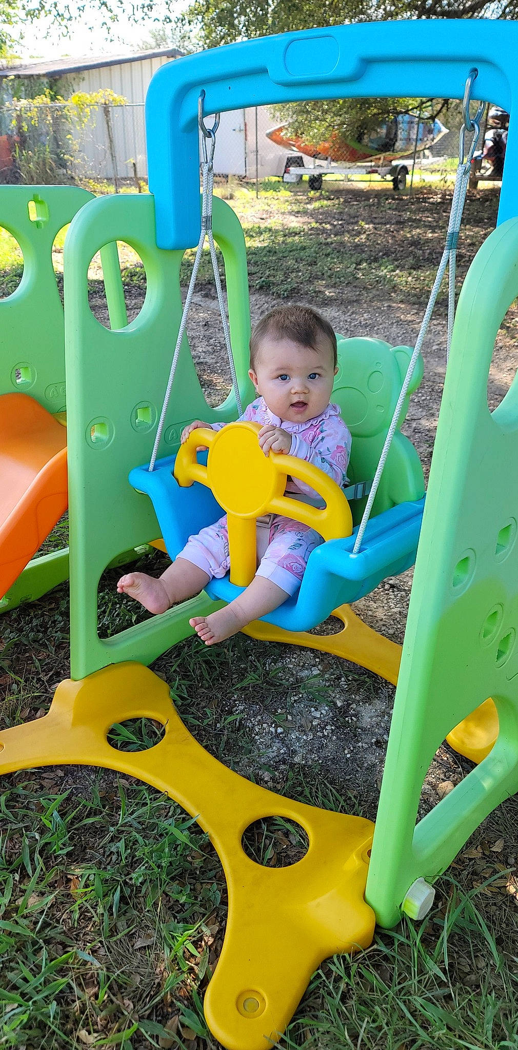 Davina is registered to the contest to win money with this photo: baby_toddler_clothing, blue, child, chute, city, fun, grass, green, human_settlement, leisure, outdoor_play_equipment, outdoor_recreation, person, photograph, playground, public_space, recreation, shorts, snapshot, surprise