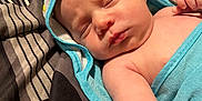 Jayden is registered to the contest to win money with this photo: baby, bed, blanket, childbirth, face, furniture, head, newborn, person, photography, portrait, quilt, sleeping, towel