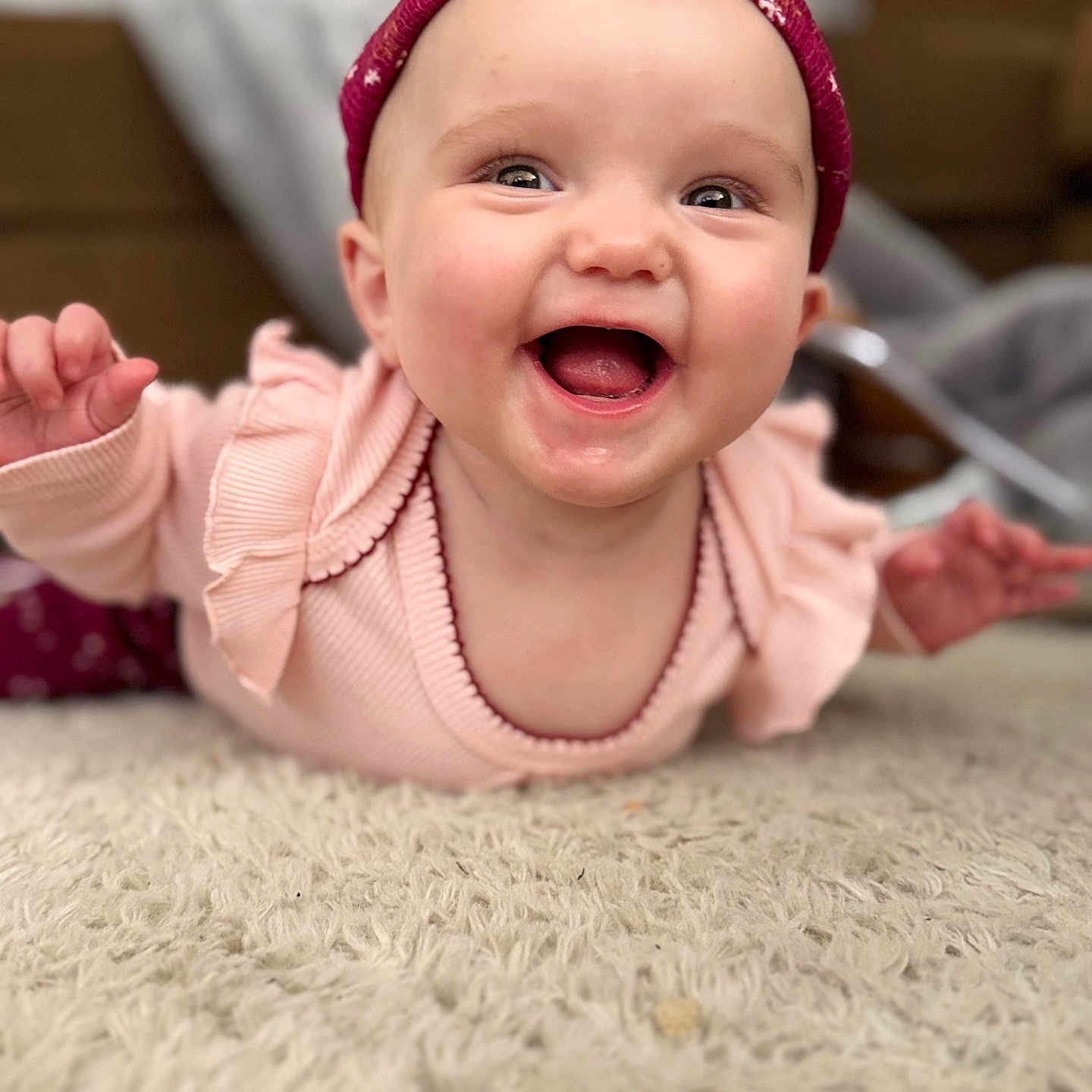 Aphelia Kay is registered to the contest to win money with this photo: baby, carpet, cheerful, child, closeup, crawling, cute, expression, face, happy, headband, headwear, indoors, infant, joyful, person, pink_clothing, smiling, soft_texture, toddler