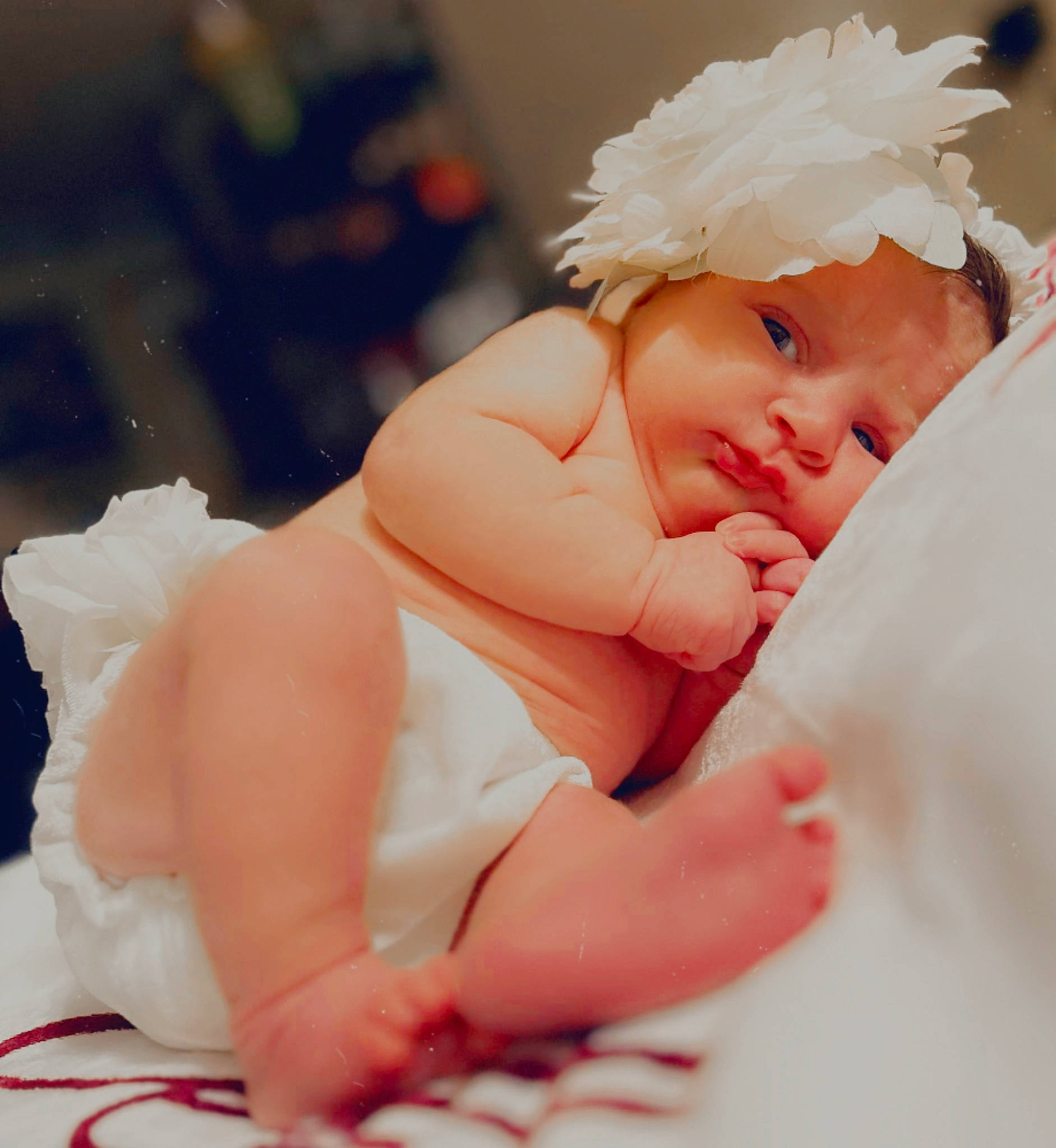 Violet is registered to the contest to win money with this photo: arm, baby, baby_sleeping, baby_toddler_clothing, comfort, eye, eyebrow, gesture, hand, happy, headgear, headpiece, headwear, human_body, leg, lip, nail, person, petal, skin