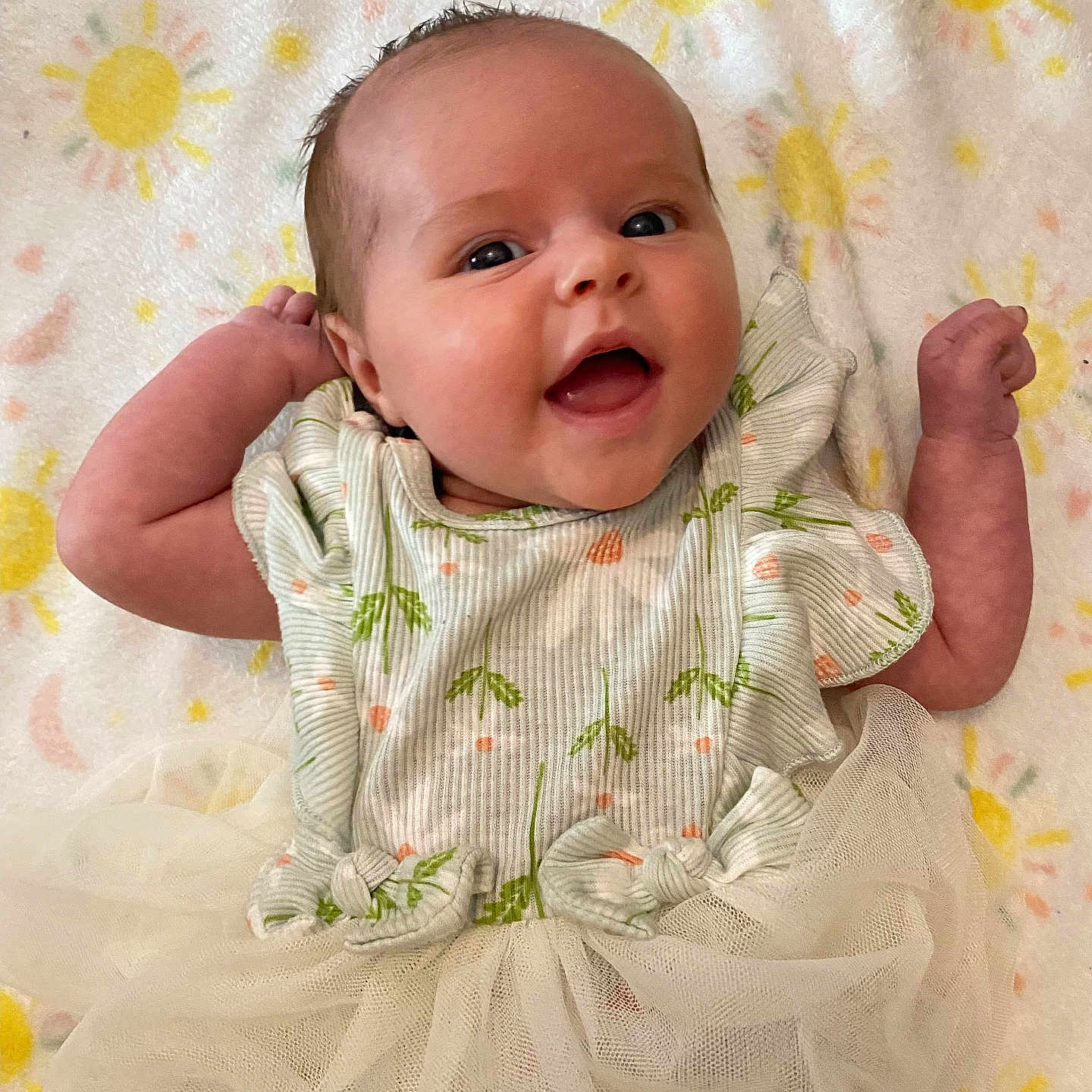 Mykinzie is registered to the contest to win money with this photo: baby, babylaughing, clothing, dress, face, happy, head, newborn, person, photography, portrait, quilt, sitting, yawning