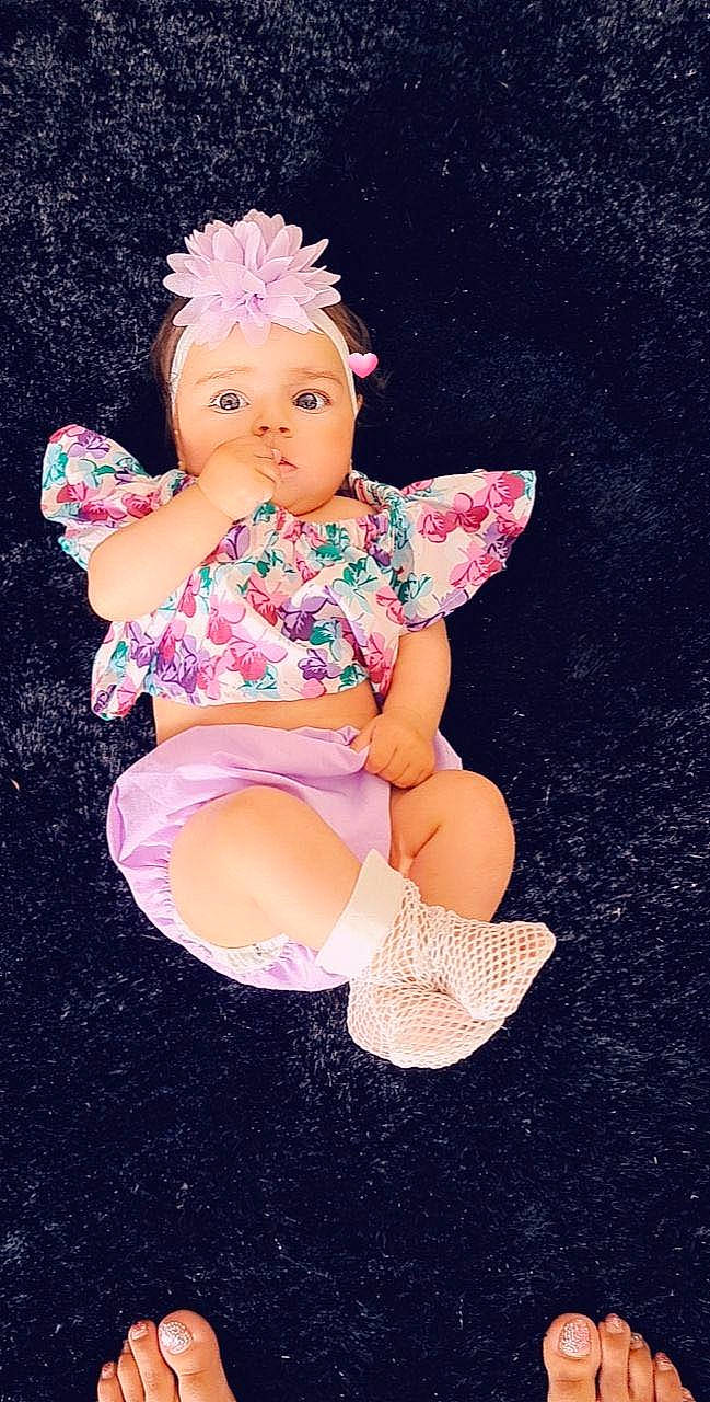 Betty Anays participe au concours pour gagner de l'argent avec cette photo : arm, baby_toddler_clothing, baby_toys, cheek, doll, finger, foot, hand, human_leg, knee, leg, magenta, person, pink, sitting, sock, thigh, thumb, toy, wig