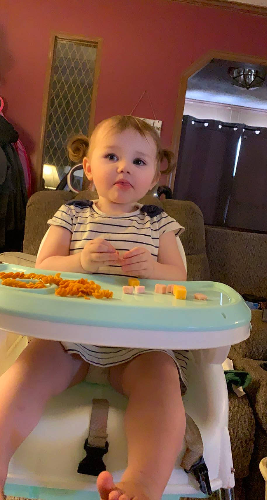 Skylar is registered to the contest to win money with this photo: baby, baking, chair, child, event, facial_expression, food, fun, home_appliance, human_leg, leisure, party, person, play, room, sitting, skin, sweetness, table, toddler