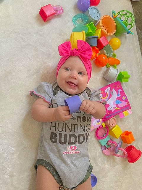 Brynleigh is registered to the contest to win money with this photo: baby, baby_playing_with_toys, baby_products, baby_toddler_clothing, child, costume, face, fashion_accessory, font, fun, happy, headwear, magenta, party_supply, pattern, person, pink, play, sleeve, smile