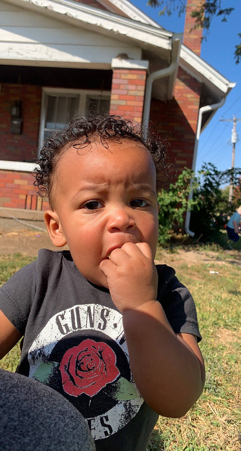 Korbyn is registered to the contest to win money with this photo: cheek, chin, cool, eyelash, finger, forehead, grass, hairstyle, happy, leaf, leisure, lip, mouth, neck, nose, person, plant, skin, toddler, tree