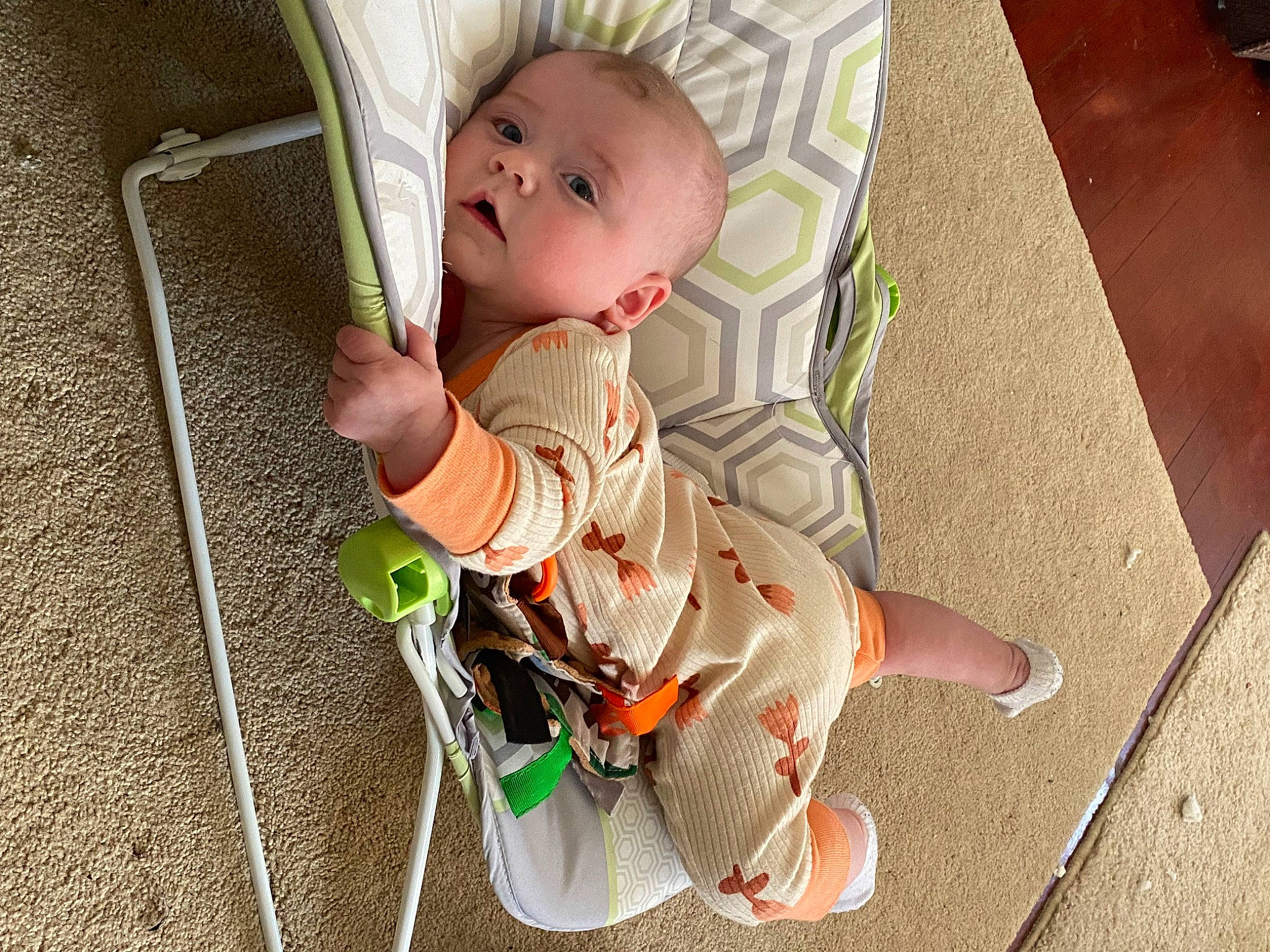 Dahlia is registered to the contest to win money with this photo: baby, baby_products, baby_toddler_clothing, chair, cheek, child, comfort, flooring, foot, fun, grass, hardwood, human_leg, knee, pattern, person, sitting, sock, thigh, toddler