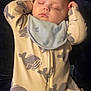 Junior joined the competition — help win amazing prizes! baby, sleeping, onesie, whale_pattern, bib, infant, peaceful, relaxed, child, face, closed_eyes, clothing, portrait, indoor, cute, soft_lighting, hands_up, young_child, cozy, resting