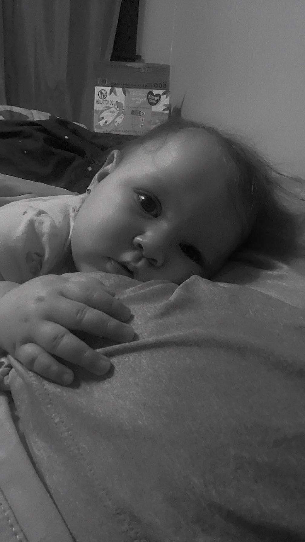 Violet is registered to the contest to win money with this photo: baby, cheek, chest, child, comfort, elbow, finger, flash_photography, gesture, hand, human_body, leg, lip, monochrome, monochrome_photography, mouth, nose, person, skin, thumb