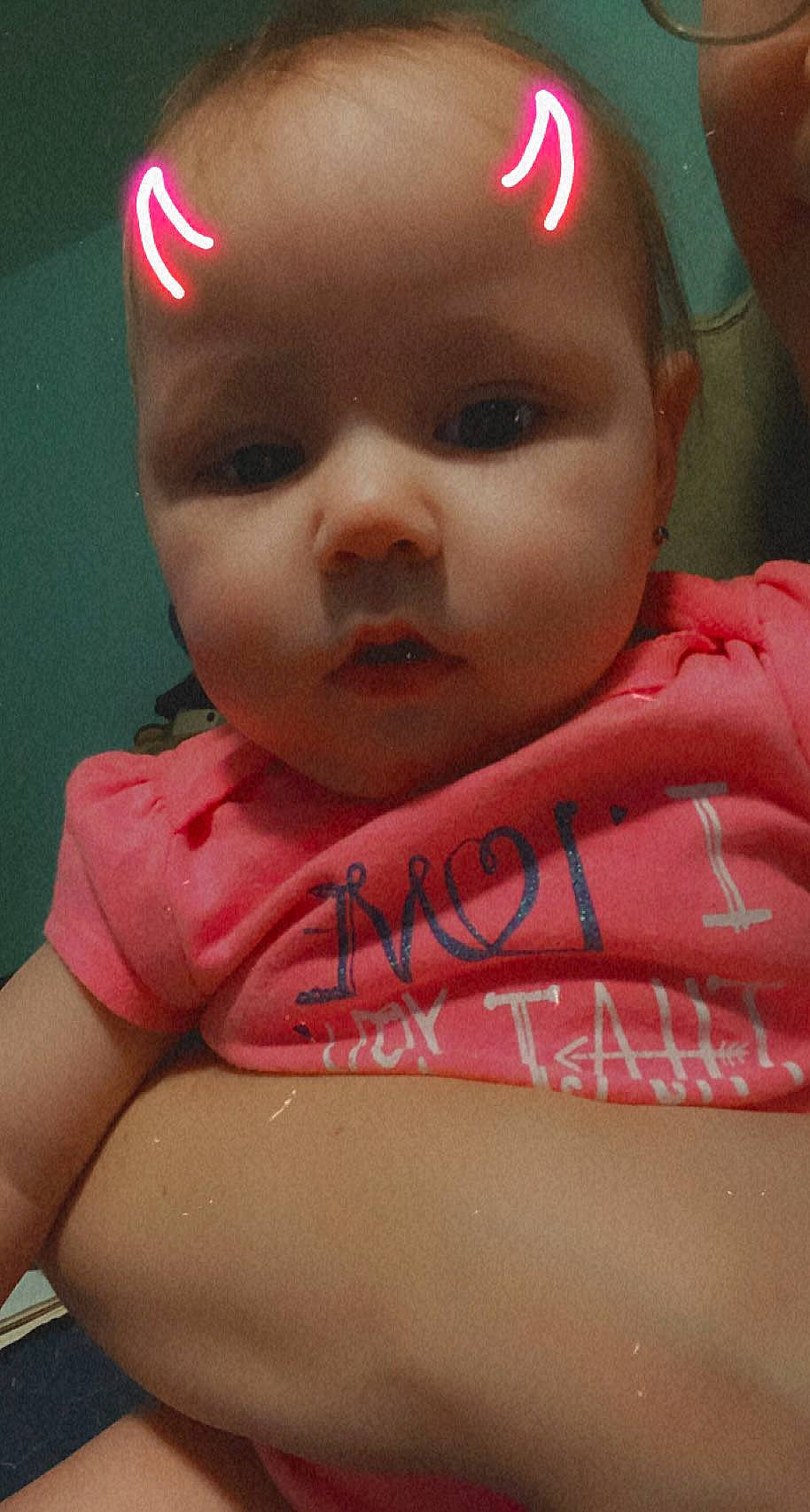 Violet is registered to the contest to win money with this photo: baby, baby_toddler_clothing, cheek, chin, ear, eyebrow, eyelash, facial_expression, finger, forehead, hairstyle, happy, lip, mouth, neck, nose, organ, person, pink, skin