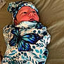 newborn, baby, swaddled, butterfly_pattern, blanket, hat, infant, cute, resting, fabric, pattern, floral, blue, white, soft, bed, child, portrait, sleepwear, cozy