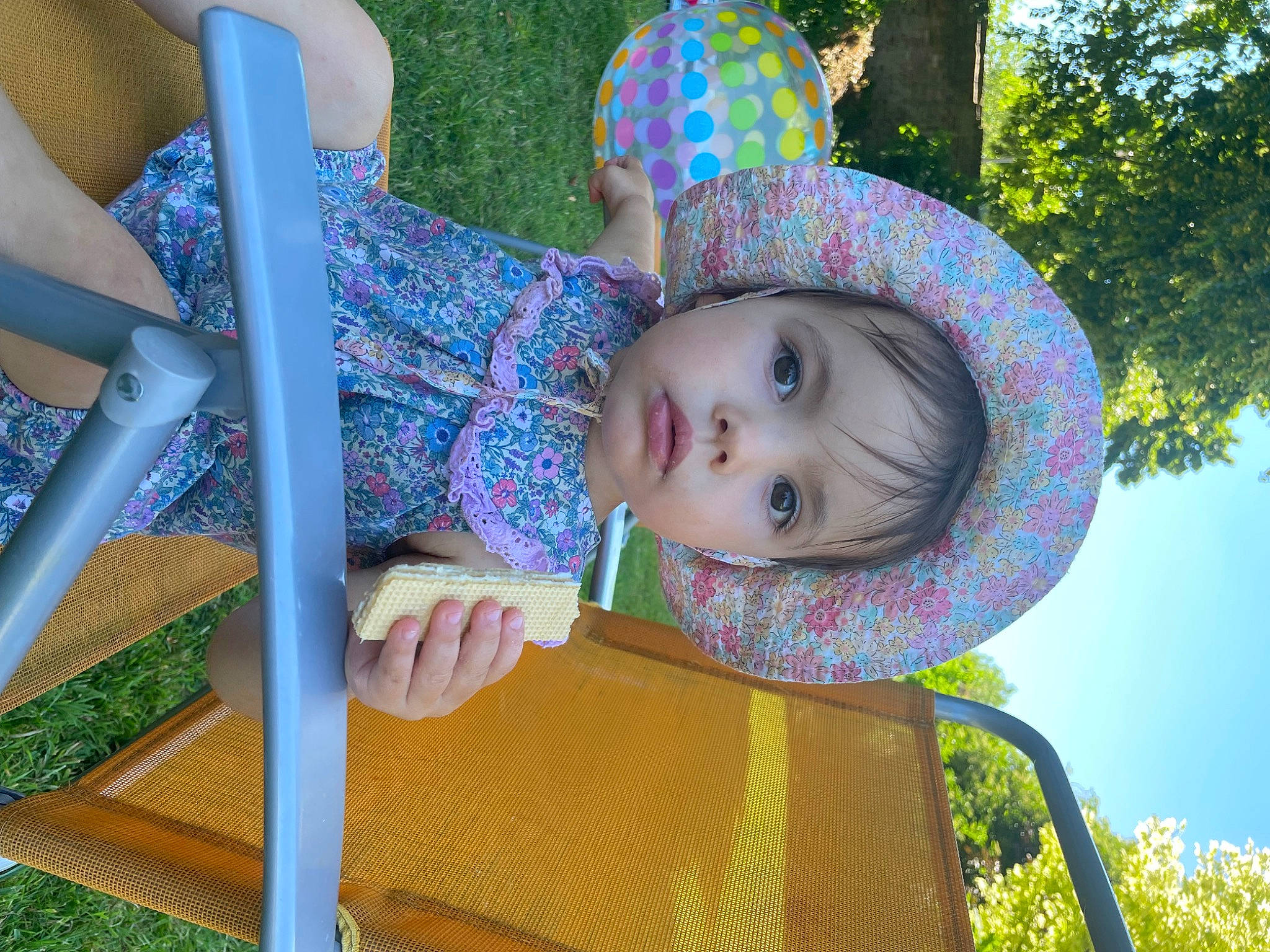 Eliza is registered to the contest to win money with this photo: baby, baby_toddler_clothing, beauty, child, city, fun, grass, happy, hat, leisure, pattern, people_in_nature, person, plant, public_space, recreation, summer, sun_hat, toddler, tree
