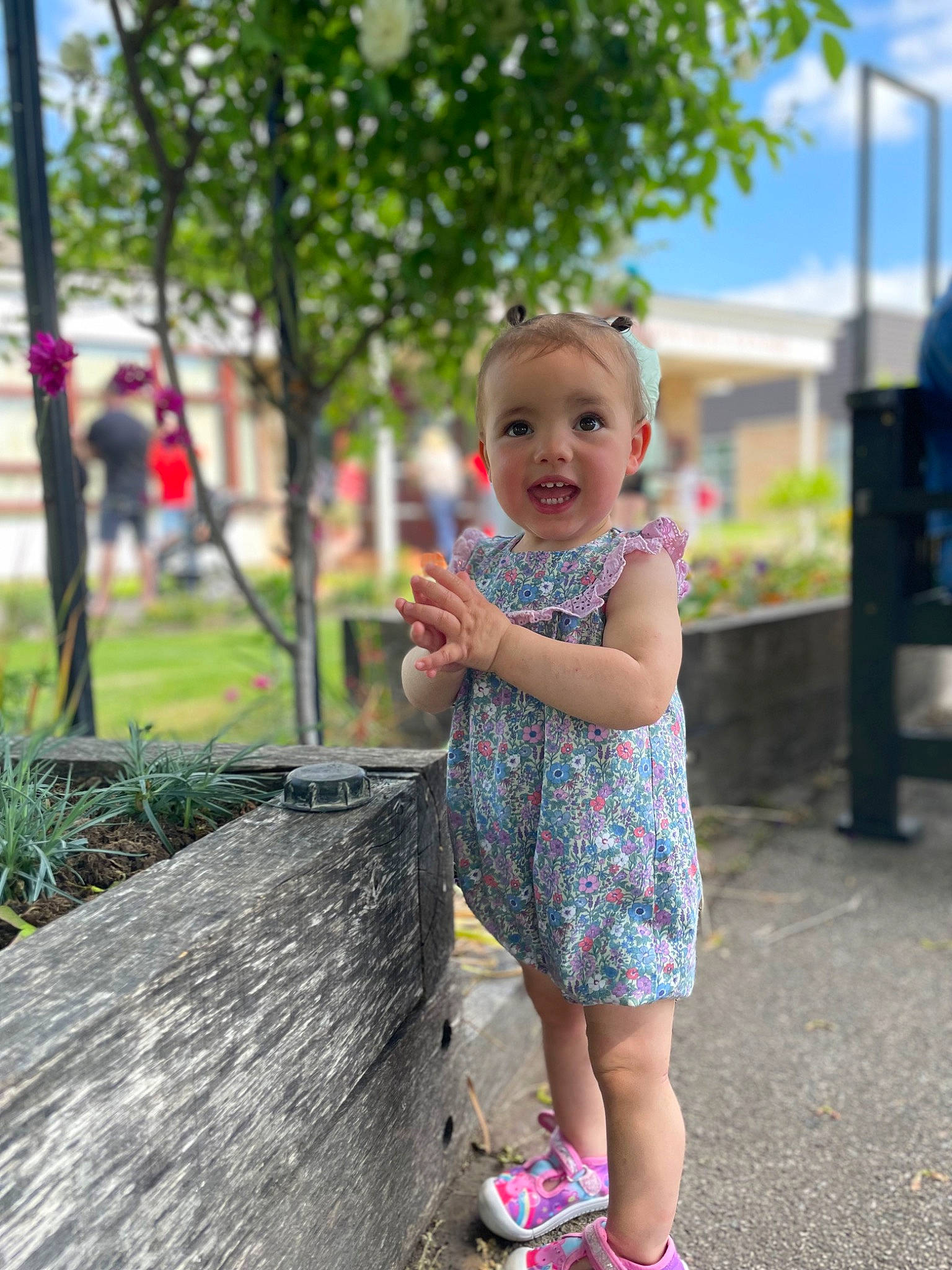Eliza is registered to the contest to win money with this photo: asphalt, baby, baby_toddler_clothing, child, city, fun, grass, happy, leisure, magenta, people_in_nature, person, pink, plant, recreation, road, sandal, sky, smile, toddler