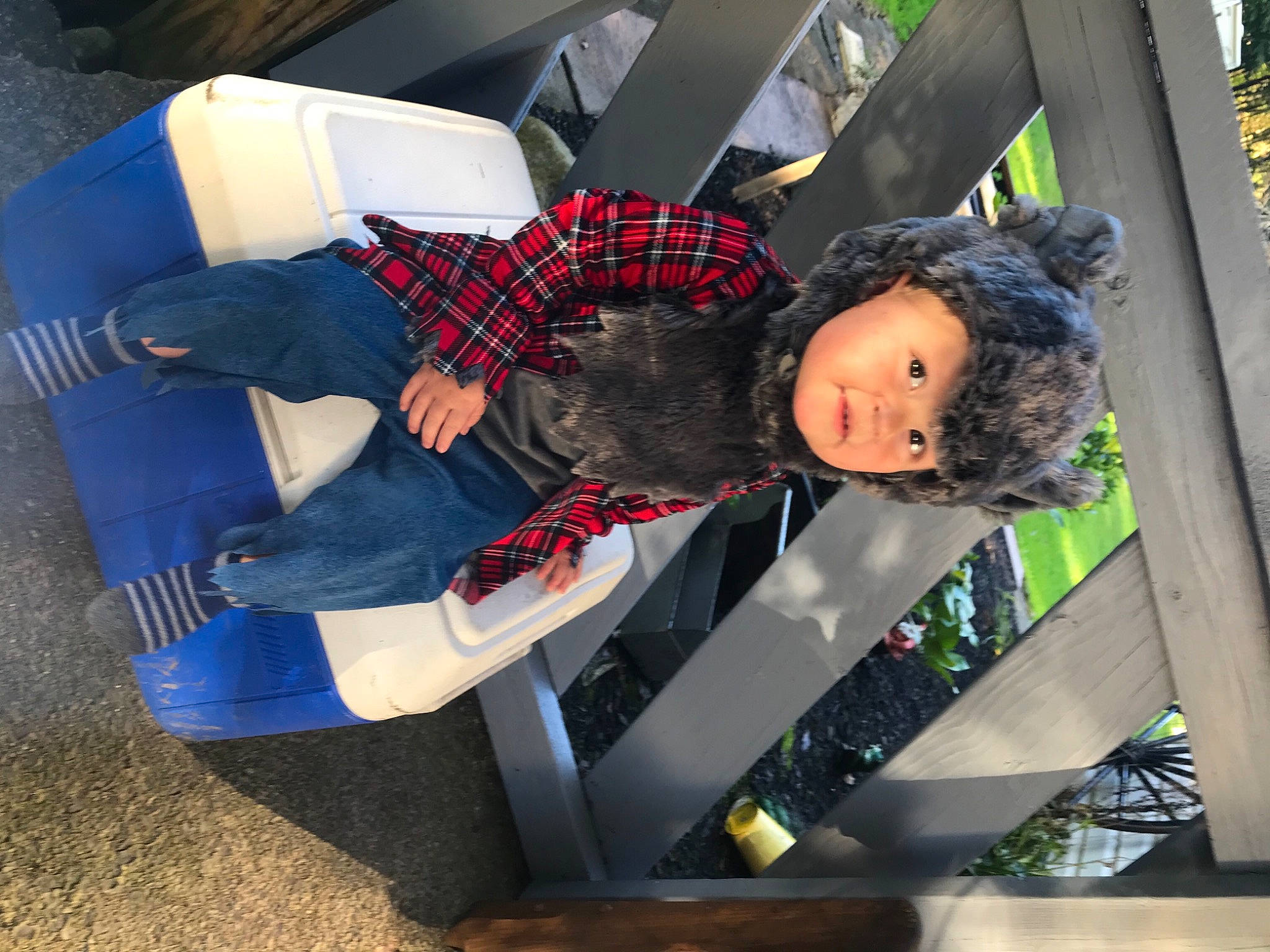 Karsen is registered to the contest to win money with this photo: auto_part, carmine, comfort, cosplay, costume, fictional_character, fun, headwear, human_leg, leisure, luxury_vehicle, pattern, person, personal_protective_equipment, plaid, recreation, sitting, street_fashion, suit, toddler