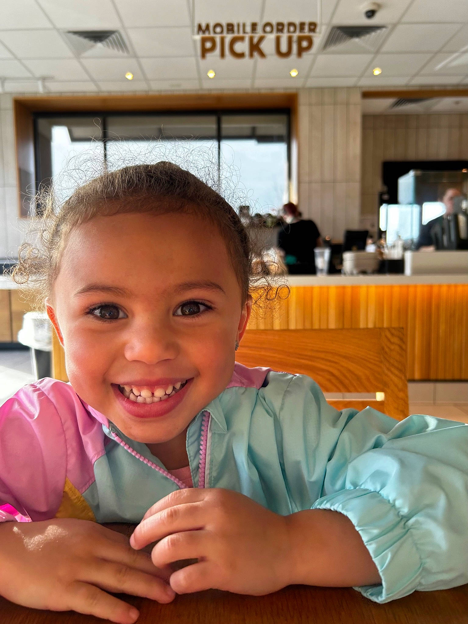 Keeley joined the competition — help win amazing prizes! chair, child, comfort, facial_expression, flooring, fun, gesture, happy, joy, laugh, leisure, person, room, sitting, skin, smile, t_shirt, thumb, toddler, vacation