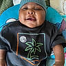 Jaking joined the competition — help win amazing prizes! baby, infant, child, portrait, face, smiling, knit_cap, black_shirt, palm_tree, clothing, cushion, blanket, indoor, closeup, sitting, lying_down, hands, arms, happy, photography