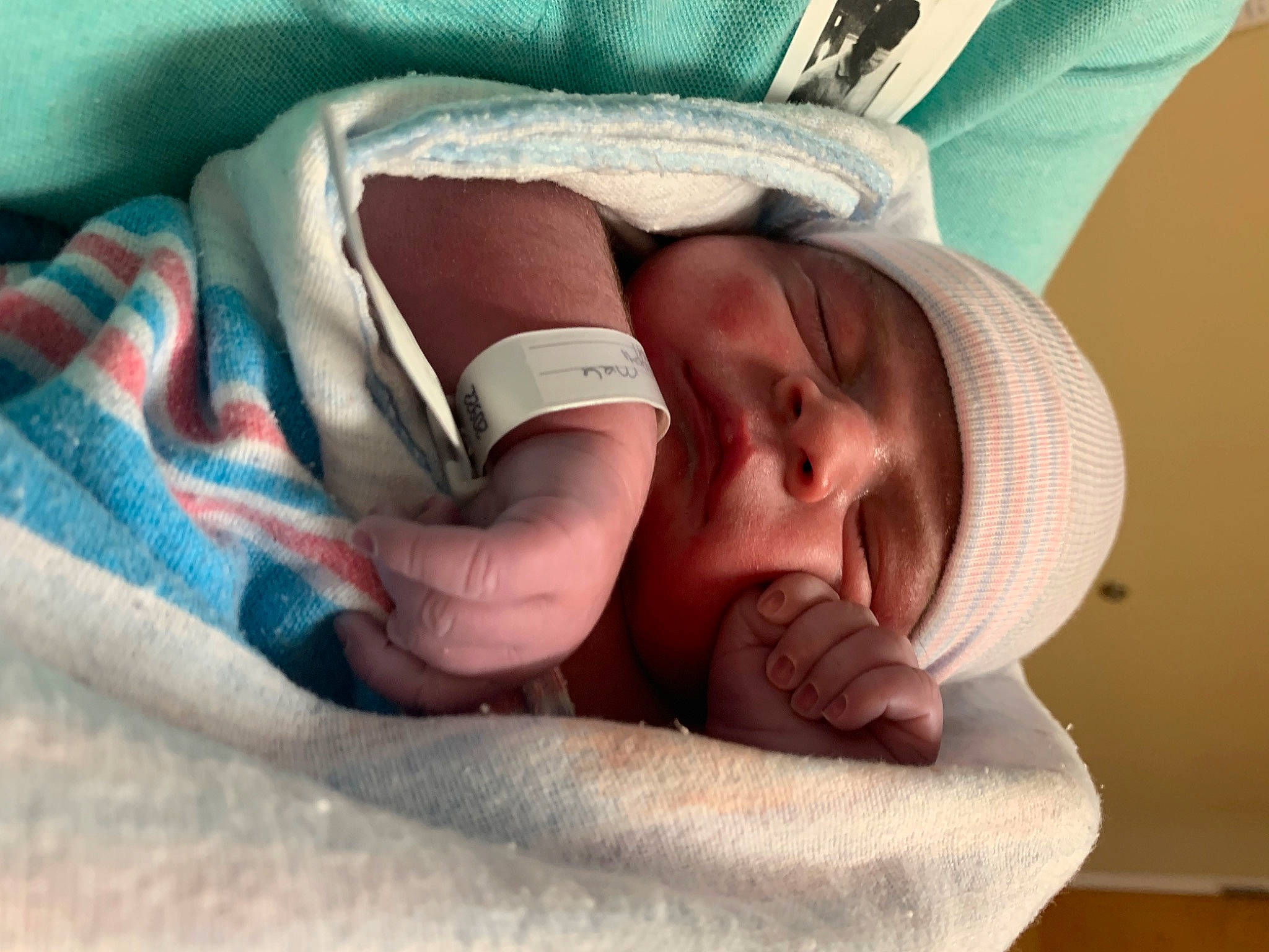 Adriel is registered to the contest to win money with this photo: arm, baby, baby_products, baby_sleeping, baby_toddler_clothing, bedding, bedtime, child, comfort, eye, finger, gesture, hand, headwear, leg, linens, nail, person, skin, textile