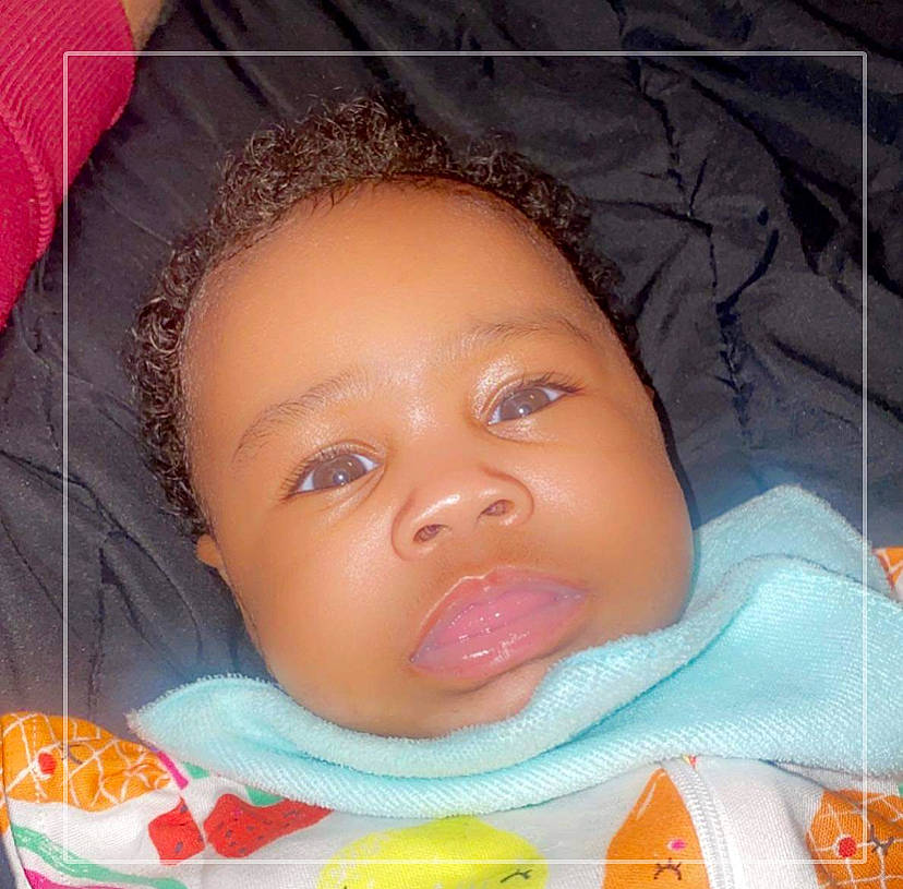 Ariah is registered to the contest to win money with this photo: baby, cheek, child, chin, ear, eye, eyebrow, eyelash, forehead, happy, iris, jaw, lip, mouth, nose, orange, person, pink, skin, smile