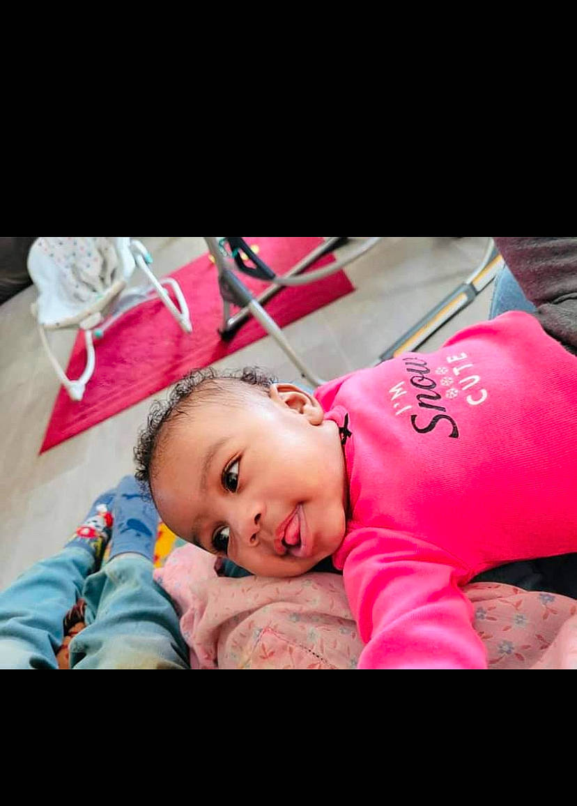 Ariah joined the competition — help win amazing prizes! baby, baby_products, baby_toddler_clothing, child, comfort, face, flash_photography, grass, happy, lip, love, magenta, nap, person, photo_caption, pink, portrait_photography, sitting, sleep, sleeve