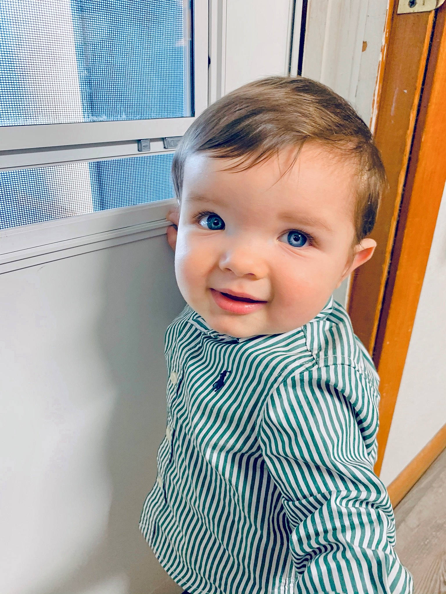 Lawson is registered to the contest to win money with this photo: baby, baby_toddler_clothing, child, child_model, ear, eye, iris, mesh, pattern, person, sleeve, toddler, window_blind, window_covering, window_treatment