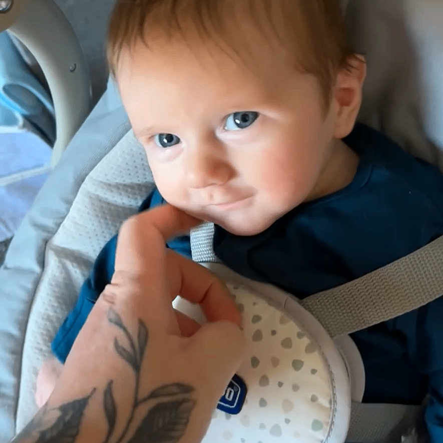 Alfie is registered to the contest to win money with this photo: accessories, arm, baby, babylaughing, belt, bodypart, face, finger, haircut, hairdresser, hand, happy, head, person, photography, portrait, skin, smile, tattoo, wrist