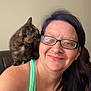 Nebula Star is registered to the contest to win money with this photo: woman, glasses, kitten, cat, shoulder, smile, portrait, indoor, tank_top, black_hair, piercing, earrings, furniture, brown_fur, pet, cute, friendly, closeup, happy, casual