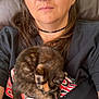 Nebula Star joined the competition — help win amazing prizes! person, glasses, piercing, cat, tortoiseshell_cat, fur, black_clothing, chair, leather, relaxing, indoor, closeup, portrait, resting, cute, pet, animal, young_adult, casual, comfort