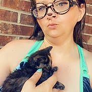 Nebula Star joined the competition — help win amazing prizes! woman, kitten, cat, holding, hand, tattoo, glasses, filter, bear_ears, brick_wall, tank_top, blue_clothing, portrait, outdoor, pet, cute, animal, young, casual, close_up