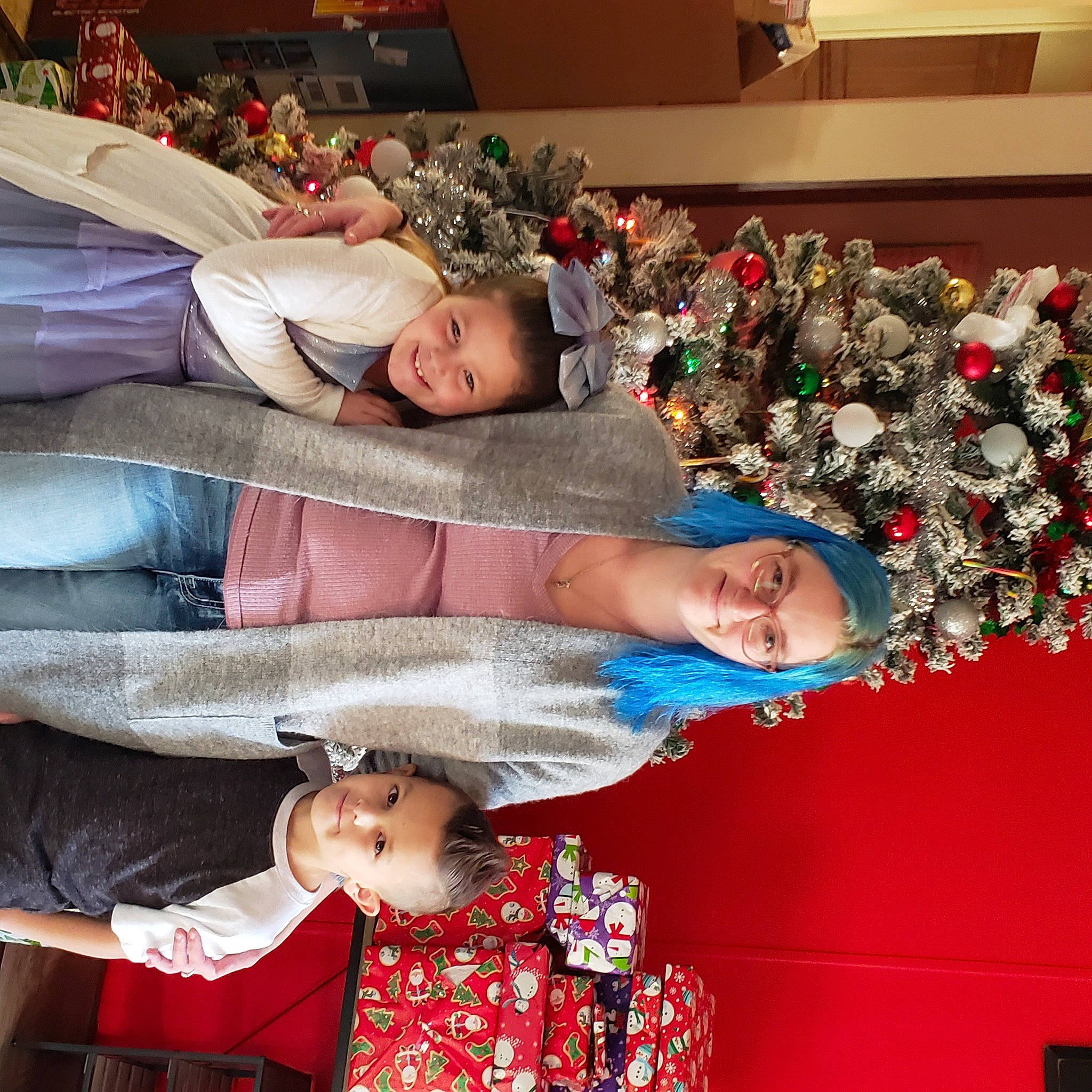 Maelynn is registered to the contest to win money with this photo: child, christmas_decoration, christmas_ornament, christmas_tree, comfort, couch, event, facial_expression, fun, happy, holiday_ornament, joy, lap, ornament, person, photograph, plant, smile, snapshot, textile