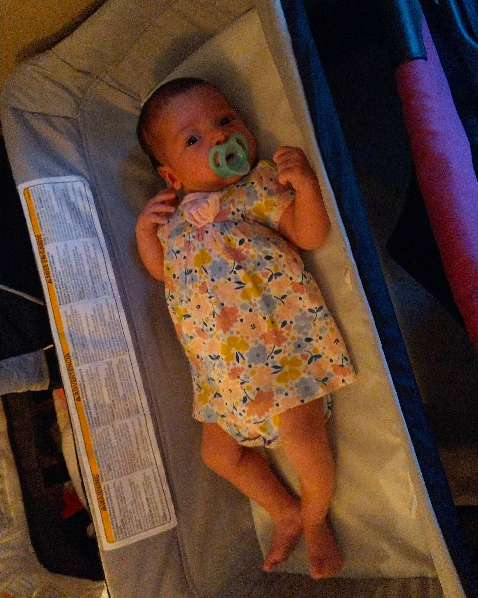 Megan is registered to the contest to win money with this photo: baby, baby_products, baby_toddler_clothing, chair, child, comfort, finger, fun, human_leg, infant_bed, lap, linens, mouth, person, product, skin, standing, textile, thigh, toddler