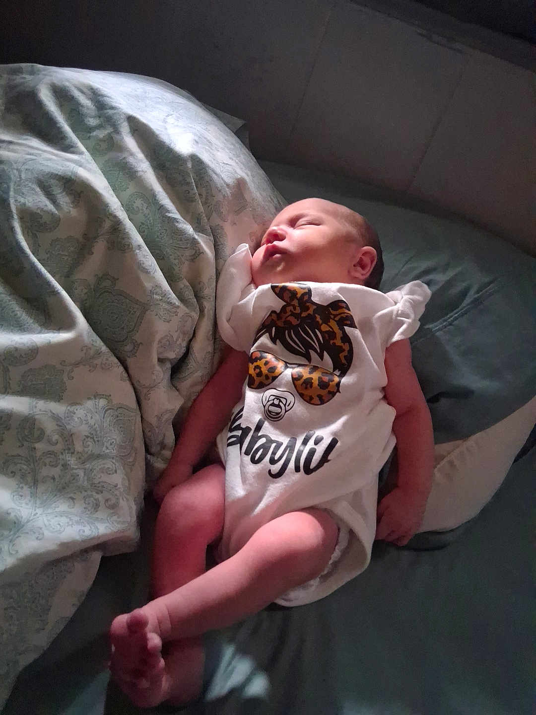 Connie Sage joined the competition — help win amazing prizes! baby, newborn, sleeping, onesie, infant, bed, blanket, pillow, pattern, soft_light, peaceful, cute, clothing, rest, child, human, skin, small, indoors, lying_down