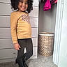Makiah is registered to the contest to win money with this photo: basket, boots, carpet, casual, child, clothing, curly_hair, door, dresser, fashion, hanger, happy, indoor, leggings, person, portrait, room, smiling, standing, sweatshirt