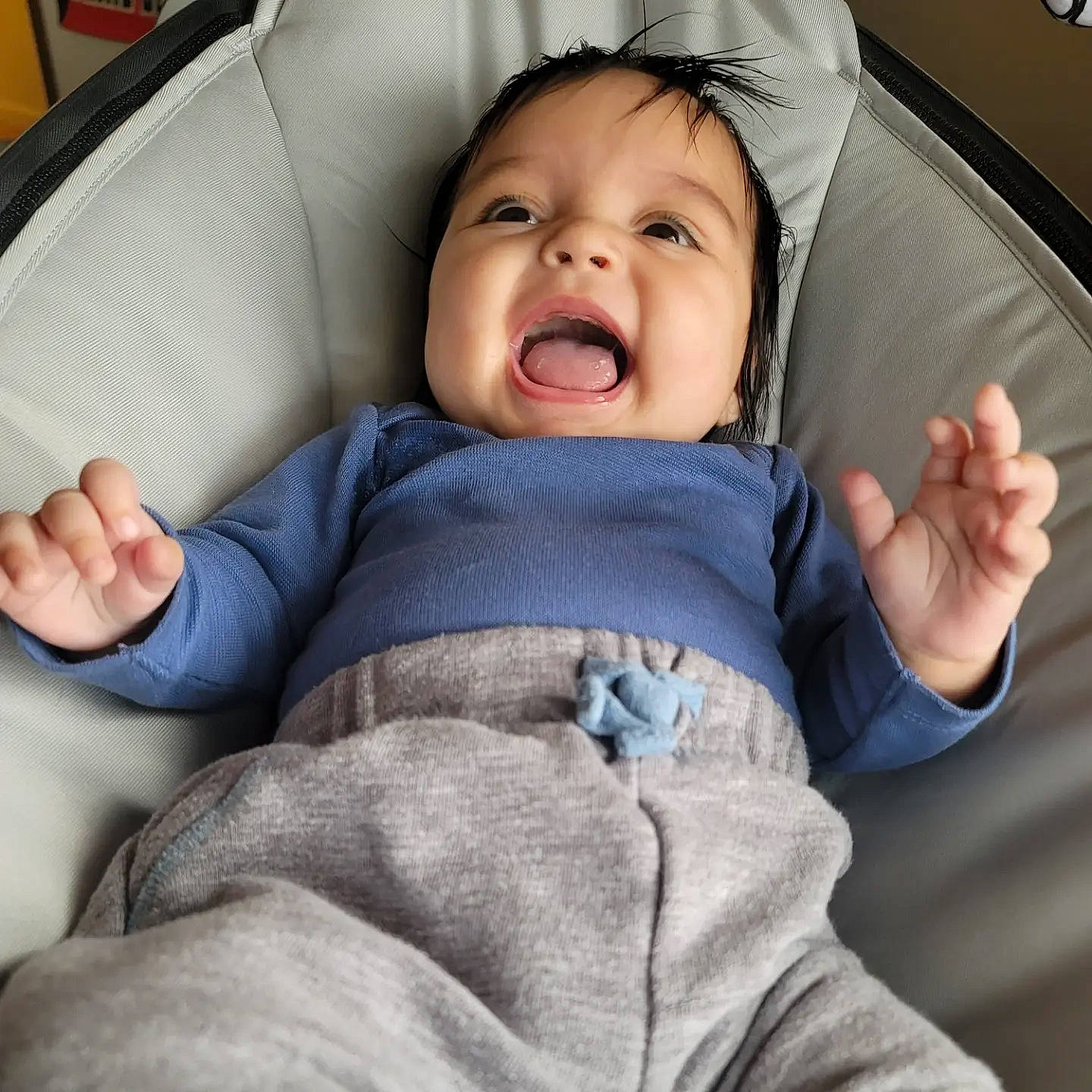 Zara is registered to the contest to win money with this photo: baby, baby_in_car_seat, baby_products, baby_toddler_clothing, cheek, comfort, face, finger, gesture, hand, head, human_body, mouth, nose, person, product, skin, sleeve, smile, thumb