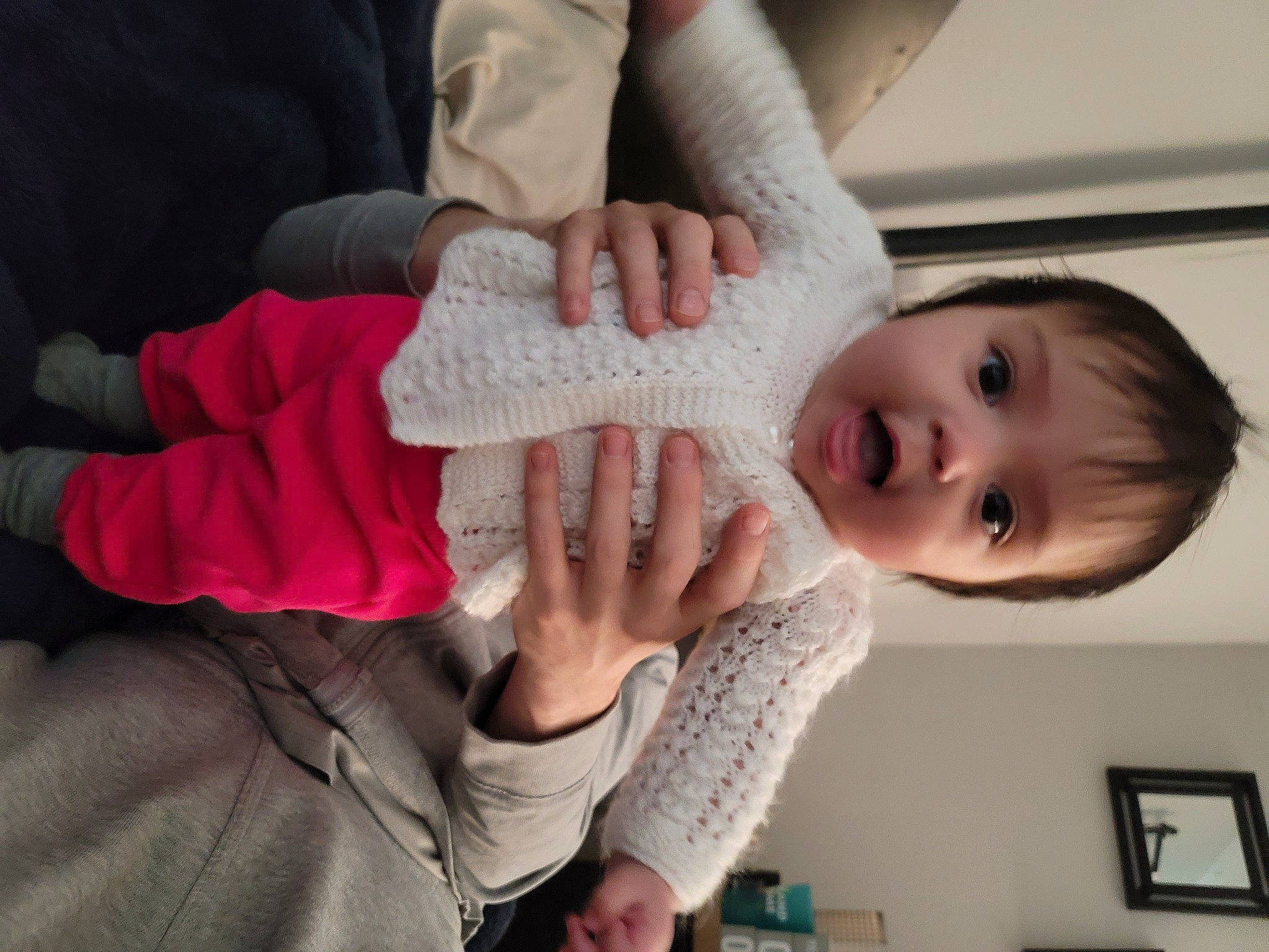 Zara is registered to the contest to win money with this photo: arm, baby, baby_toddler_clothing, cheek, comfort, ear, eye, finger, gesture, hand, happy, human_body, leg, lip, mouth, neck, nose, person, picture_frame, skin