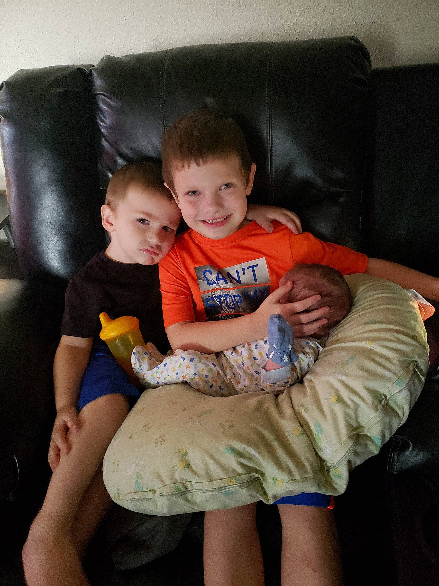 Jacoby is registered to the contest to win money with this photo: baby, chair, child, couch, daughter, family, fun, furniture, happy, joy, lap, leg, people, person, play, room, sibling, sitting, skin, smile