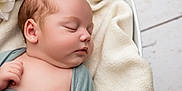 Amara joined the competition — help win amazing prizes! baby, sleeping, infant, face, skin, blanket, soft, peaceful, closeup, newborn, wrapped, cozy, cuddle, rest, child, portrait, cute, relaxation, calm, indoors