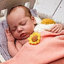Amara joined the competition — help win amazing prizes! baby, sleeping, blanket, pink, sunflower, hand, face, wooden_cradle, pillow, cozy, soft, infant, peaceful, resting, cute, knitted, decor, child, indoors, portrait