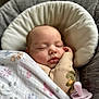 Amara is registered to the contest to win money with this photo: baby, sleeping, blanket, pacifier, cushion, face, infant, soft, comfort, rest, peaceful, cute, child, wrapped, indoors, closeup, newborn, relax, cozy, portrait