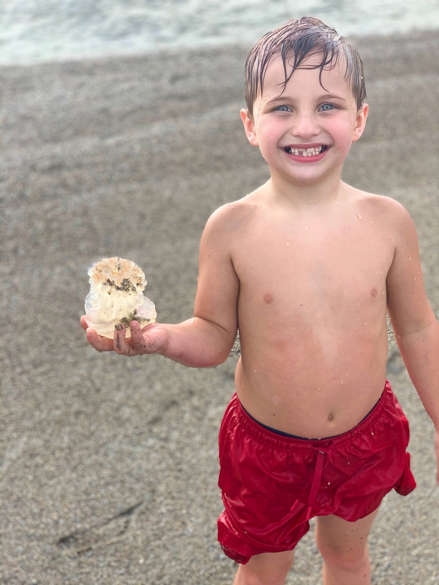 Conner joined the competition — help win amazing prizes! abdomen, barechested, beach, child, facial_expression, fun, happy, joy, muscle, person, play, sand, sea, shorts, smile, standing, summer, toddler, trunk, vacation
