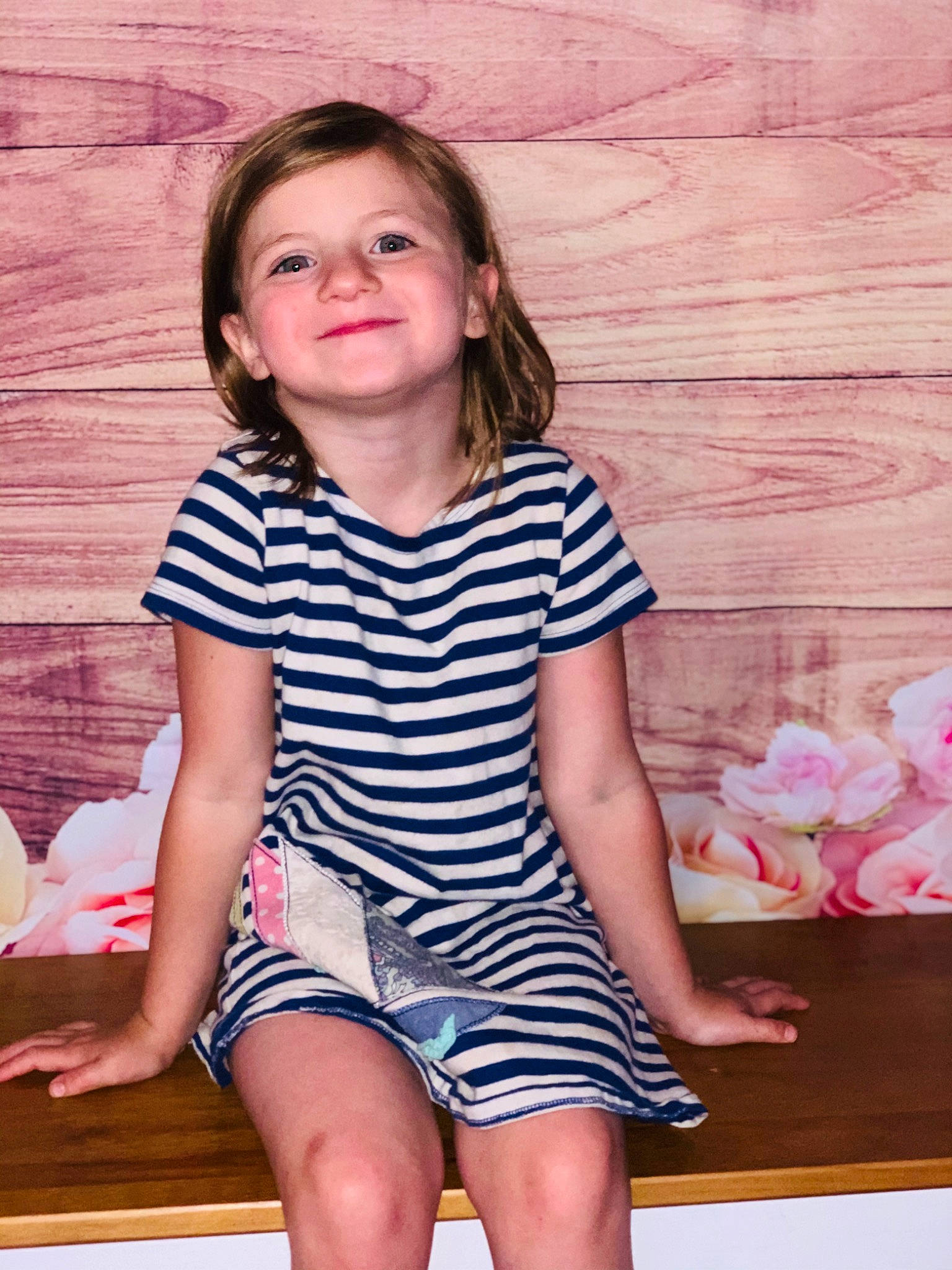 Rayven is registered to the contest to win money with this photo: cheek, child, child_model, clothing, face, joy, leg, person, pink, shorts, sitting, smile, t_shirt, thigh, toddler, vacation