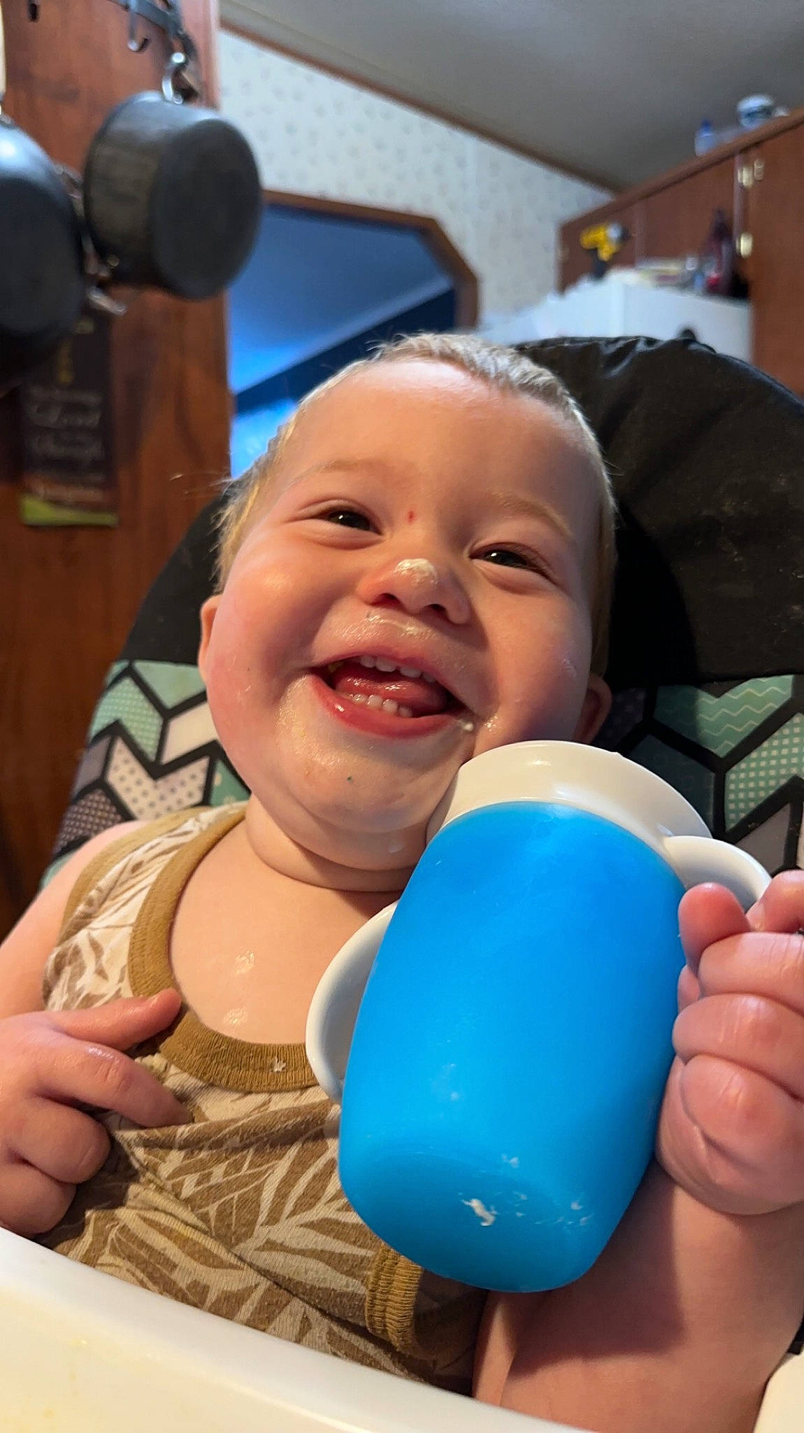 William is registered to the contest to win money with this photo: baby, baby_laughing, balloon, child, electric_blue, event, finger, fun, gesture, happy, joy, laugh, leisure, party_supply, person, recreation, sitting, skin, smile, thumb
