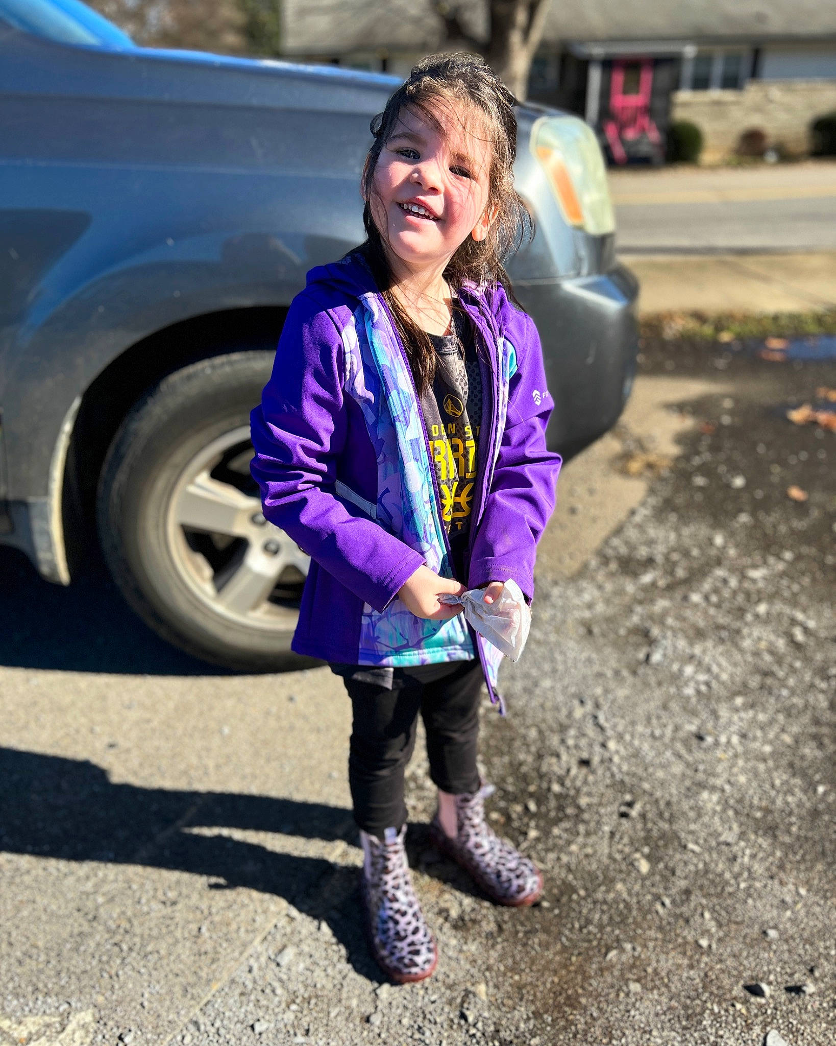 Hazel joined the competition — help win amazing prizes! asphalt, automotive_exterior, automotive_tire, automotive_wheel_system, car, electric_blue, grass, jacket, land_vehicle, motor_vehicle, parking, person, rim, road, road_surface, smile, tire, toddler, vehicle, vehicle_door