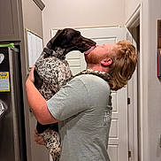 Gunner joined the competition — help win amazing prizes! affection, animal, beard, calendar, casual_clothing, dog, door, friendship, happy_moment, holding, home, indoor, kitchen, licking, man, pet, redhead, refrigerator, short_sleeve, spotted_dog