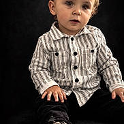 Maëlan a rejoint le concours — aidez-le/la à gagner de superbes lots ! toddler, child, portrait, striped_shirt, black_pants, shoe, sole, sitting, curious_eyes, indoor, studio, fashion, cute, young_child, hands, face, clothing, footwear, expression, background