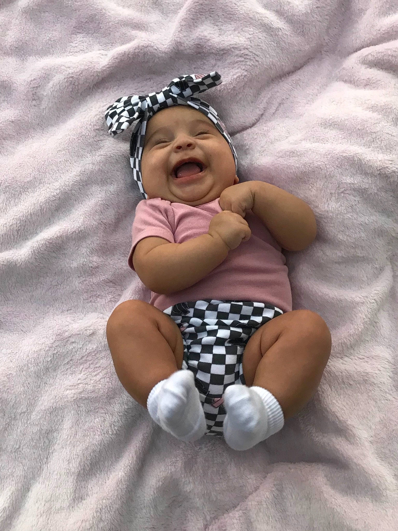 Jazlyn is registered to the contest to win money with this photo: baby, baby_bloomers, baby_products, baby_toddler_clothing, child, comfort, costume_accessory, embellishment, foot, hair_accessory, headband, headpiece, headwear, person, sock, stomach, toddler