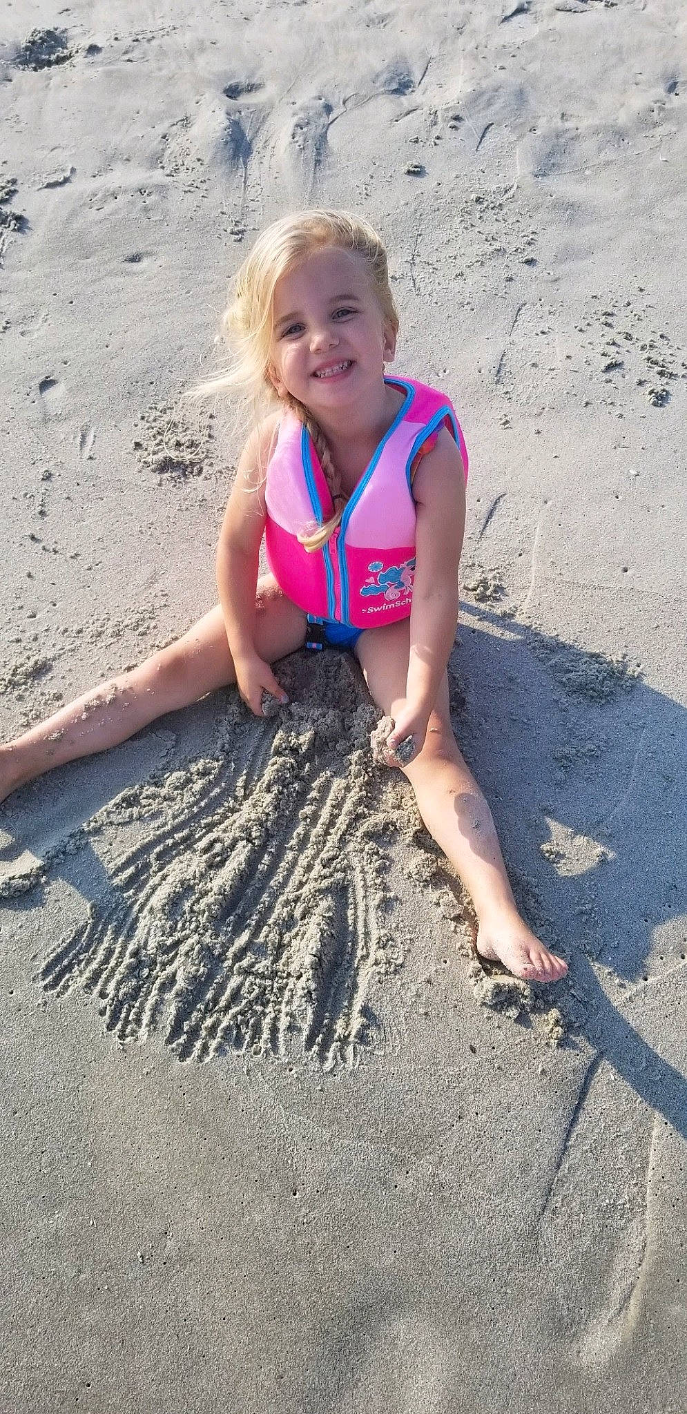 Gracie is registered to the contest to win money with this photo: barefoot, beach, child, electric_blue, foot, fun, hair, happy, human_leg, joy, people_in_nature, people_on_beach, person, sand, shadow, smile, soil, t_shirt, thigh, toddler