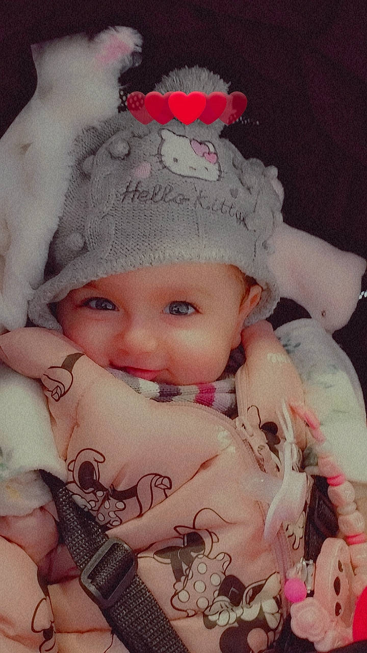 Kataleya participe au concours pour gagner de l'argent avec cette photo : art, baby, baby_toddler_clothing, cap, cheek, child, costume_hat, eye, eyelash, hat, headgear, headwear, knit_cap, lip, pattern, person, pink, skin, sleeve, textile