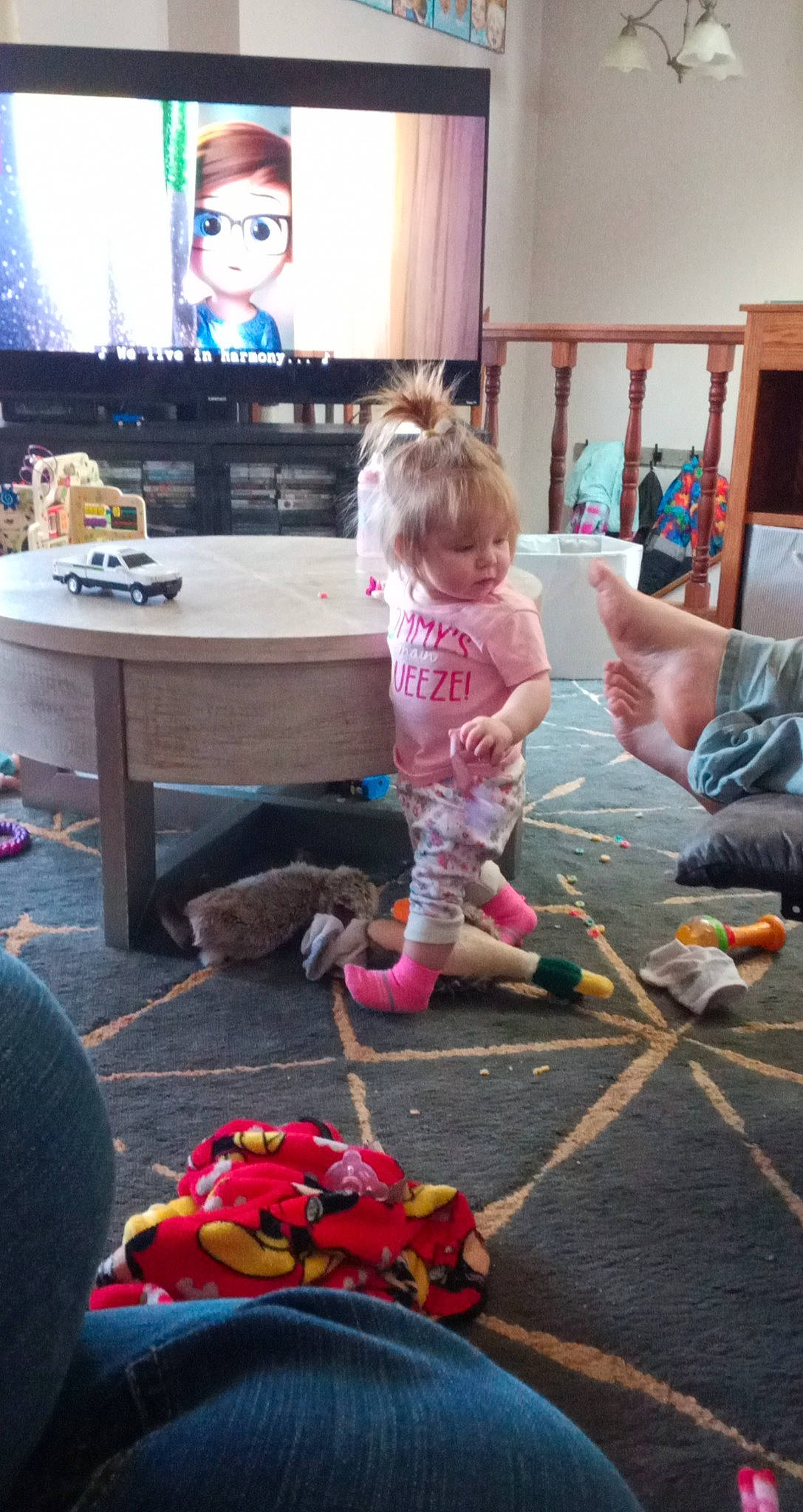 Audrianna is registered to the contest to win money with this photo: beauty, black, child, desk, electronic_device, entertainment_center, floor, flooring, fun, hairstyle, home_appliance, leisure, living_room, mammal, person, pink, standing, table, television, television_set