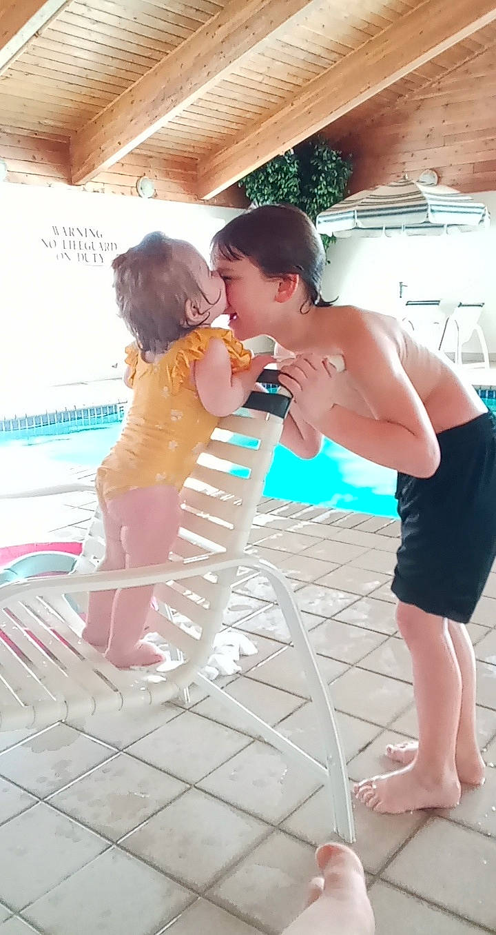 Audrianna is registered to the contest to win money with this photo: barefoot, bridal_clothing, dress, event, flash_photography, flooring, fun, gesture, hairstyle, happy, interaction, leisure, person, sandal, shoulder, skin, summer, swimming_pool, thigh, toddler