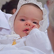 Valentina participe au concours pour gagner de l'argent avec cette photo : baby, infant, child, face, headwear, white_clothing, hand, thumb_sucking, close_up, portrait, soft_light, cute, curious, calm, skin, newborn, person, indoors, fabric, bonnet